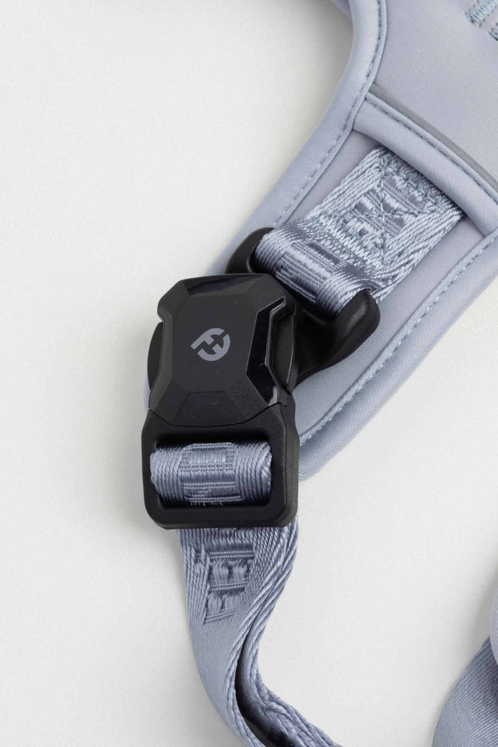 Dusk Blue Cloud Harness with MagEase Buckles Close-up of a dog harness with a black buckle and Fei and Eve logo