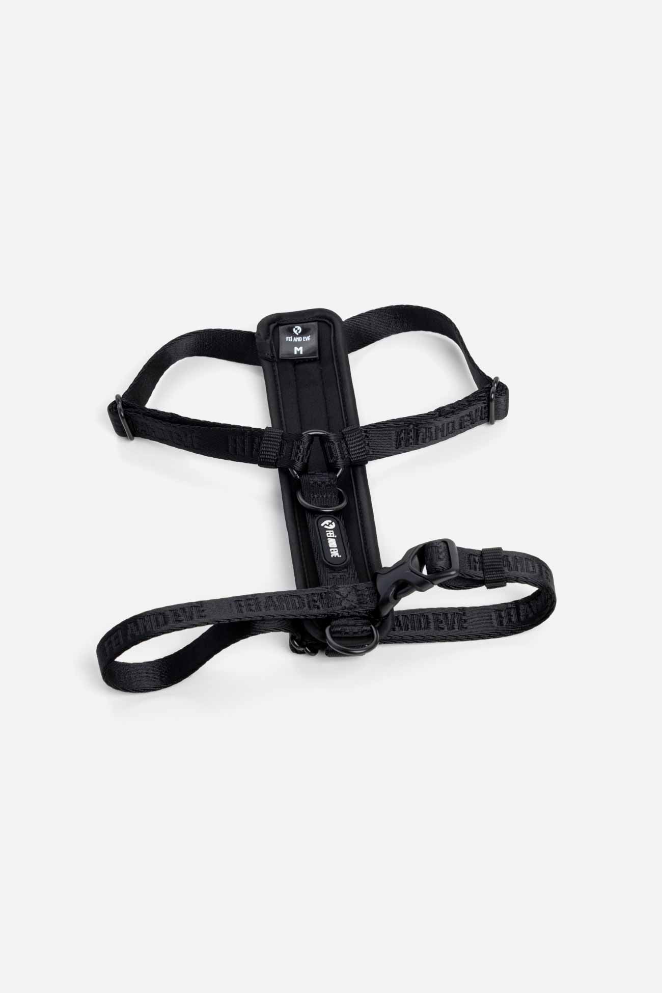 Black Moxie Harness with Traditional Buckles in size Medium for dogs on a white background.