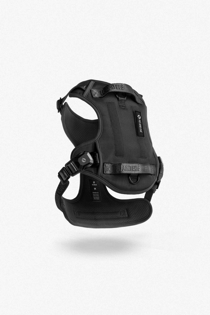 Black Classic Harness with MagEase Buckles in size Medium for dogs floating on a white background.